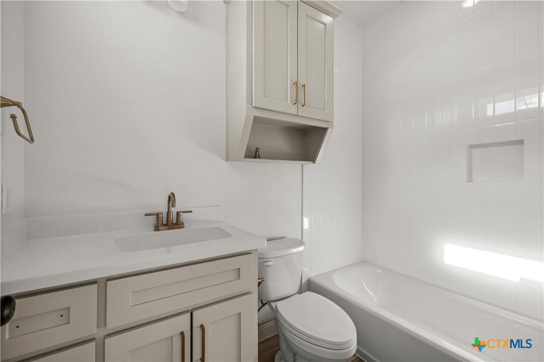 1835 Ember Drive Temple, TX 76502 - Photo 20 of 44 a bathroom with a sink a toilet and vanity