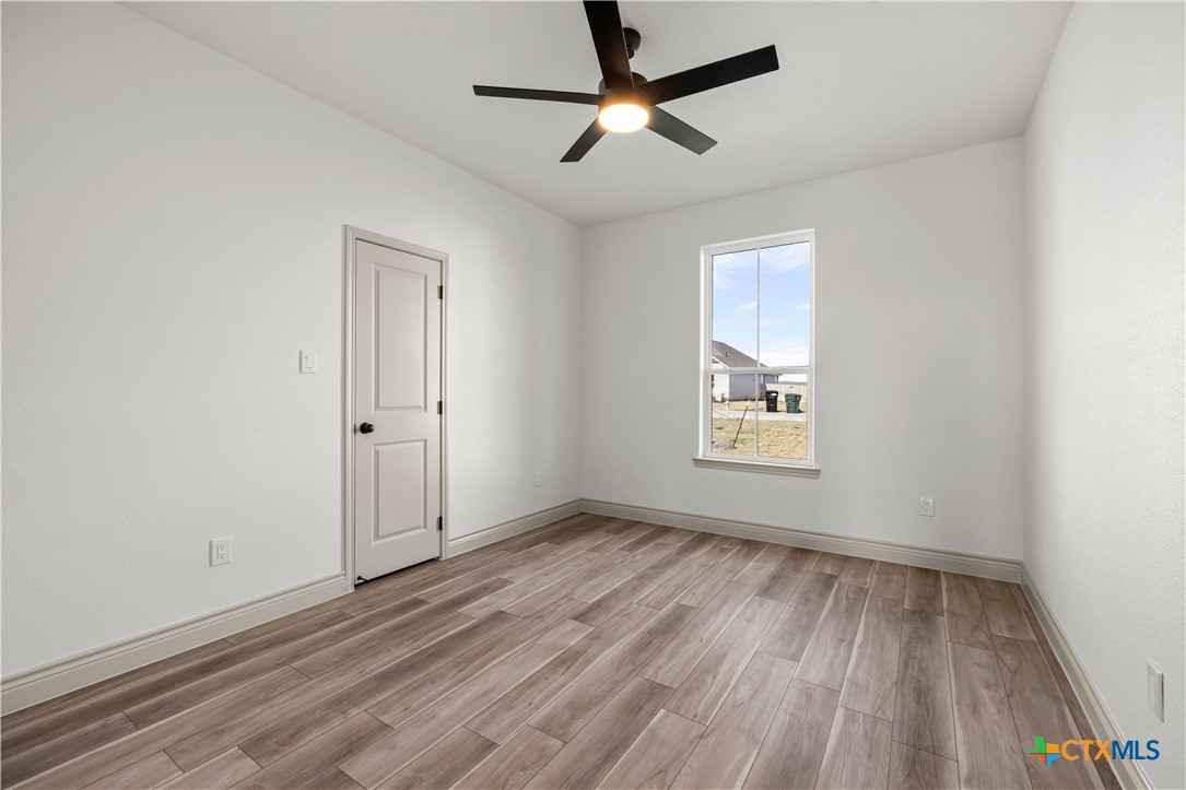 1835 Ember Drive Temple, TX 76502 - Photo 21 of 44 wooden floor in an empty room with a window