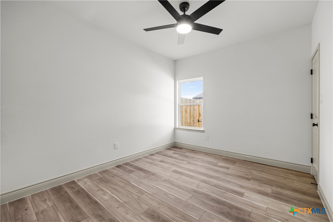 1835 Ember Drive Temple, TX 76502 - Photo 22 of 44 wooden floor in an empty room with a window