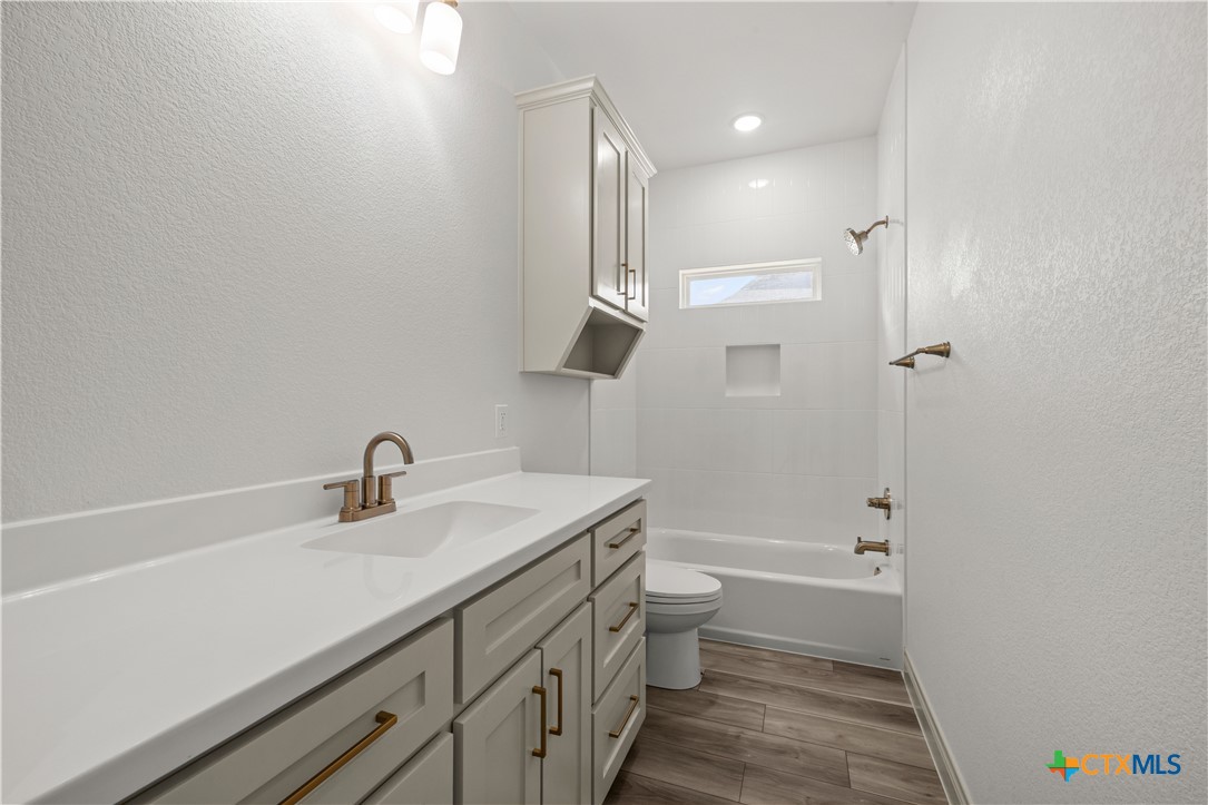 1835 Ember Drive Temple, TX 76502 - Photo 37 of 44 a bathroom with a sink a toilet and shower