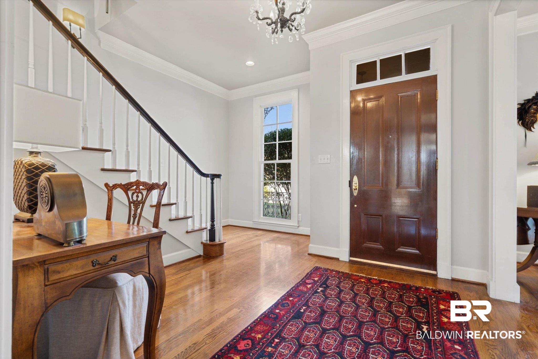 3615 Stein Street Mobile, AL 36608 - Photo 5 of 44 Entrance foyer featuring stairway, crown molding, wood finished floors, a chandelier, and recessed lighting