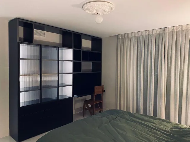 a view of a livingroom with furniture and staircase