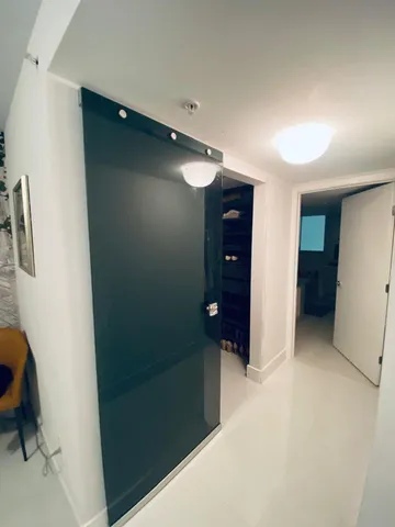 an empty room with closet and a bathroom