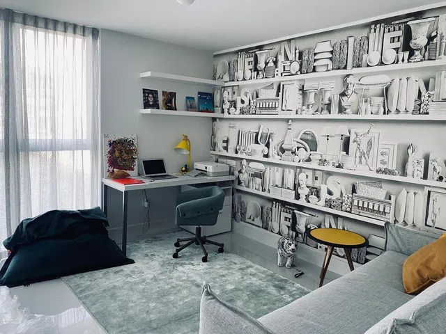 a living room with furniture cabinets and window