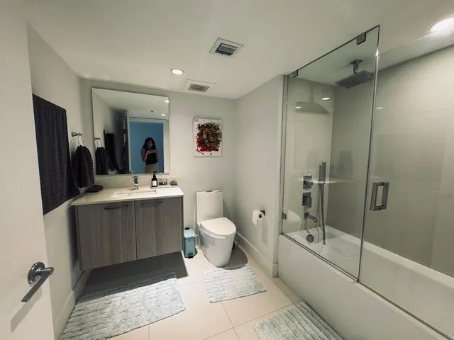 a bathroom with a bathtub and a shower