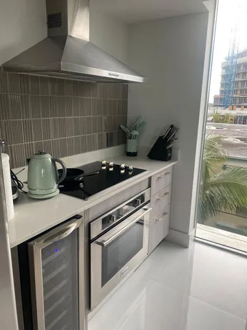 a kitchen with a stove and a sink