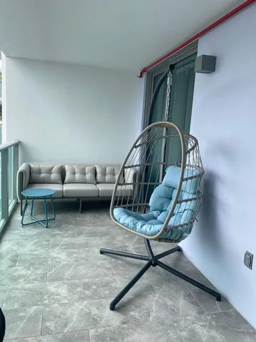 a table with chairs and a lamp