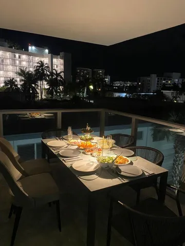 a house view with swimming pool in front of it