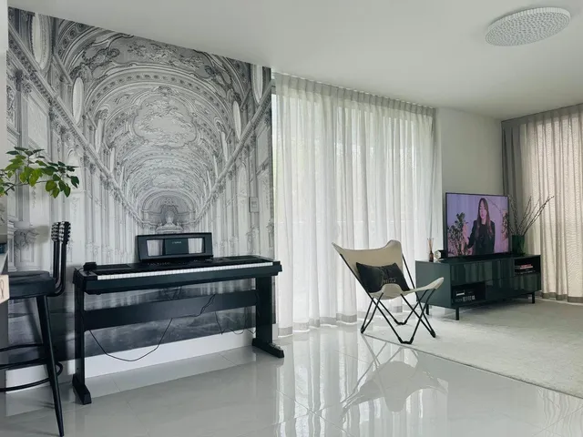 a living room with furniture and a fireplace