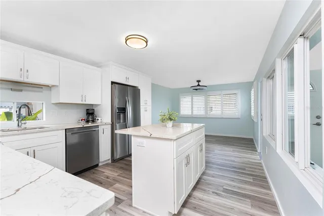 a view of a livingroom with furniture and windows
