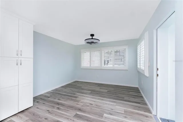 a view of a room with wooden floor
