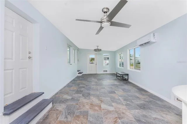 a white toilet sitting next to a bath tub