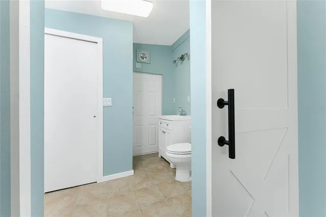 a house view with swimming pool and sitting space