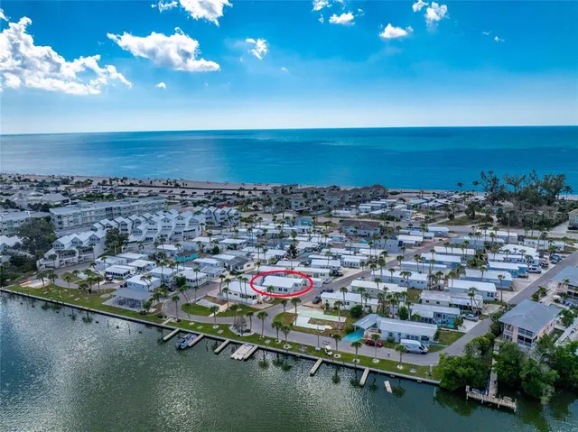a kitchen with cabinets appliances a sink and a counter top space