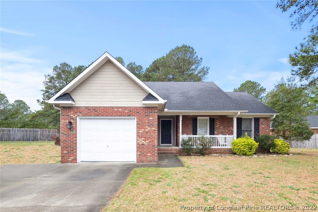 114 Windsor Lane Raeford, NC 28376 - Photo 1 of 32 a view of a house with a yard and large tree