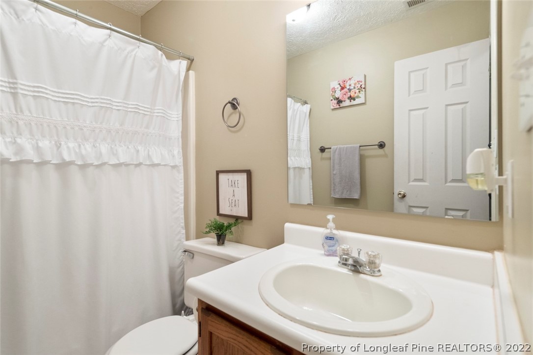 114 Windsor Lane Raeford, NC 28376 - Photo 19 of 32 a bathroom with a sink and a mirror