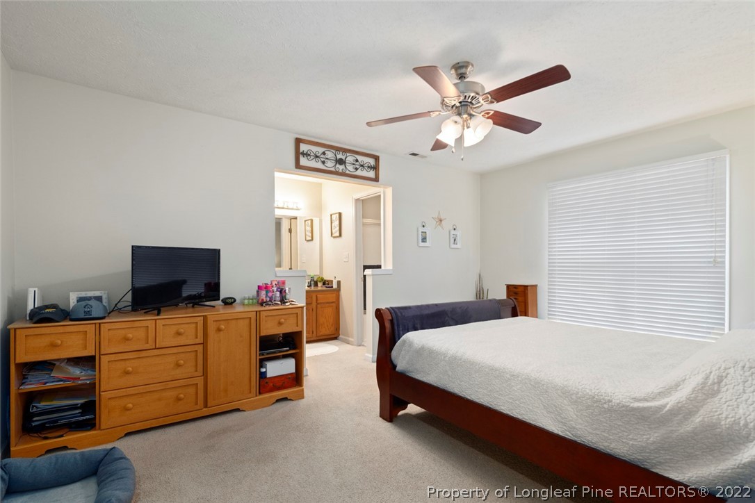 114 Windsor Lane Raeford, NC 28376 - Photo 22 of 32 a bedroom with a bed and furniture