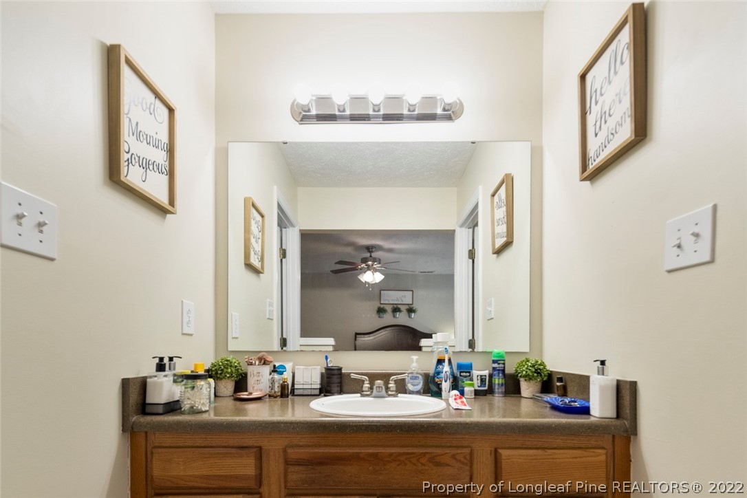 114 Windsor Lane Raeford, NC 28376 - Photo 25 of 32 a bathroom with a sink and a mirror