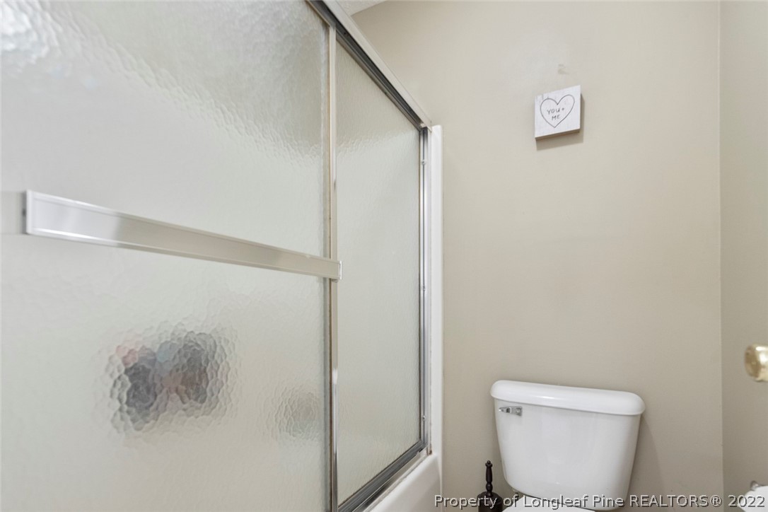 114 Windsor Lane Raeford, NC 28376 - Photo 26 of 32 a white toilet sitting next to a shower