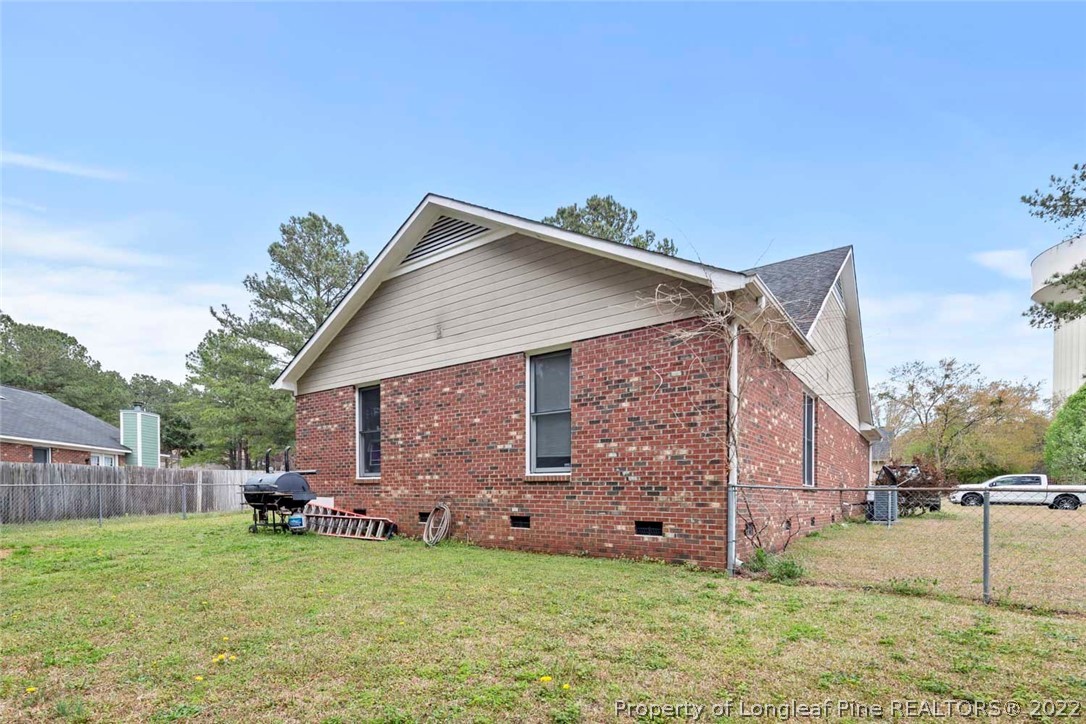 114 Windsor Lane Raeford, NC 28376 - Photo 28 of 32 a view of a back yard of the house