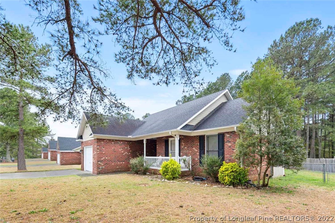 114 Windsor Lane Raeford, NC 28376 - Photo 3 of 32 a front view of a house with garden