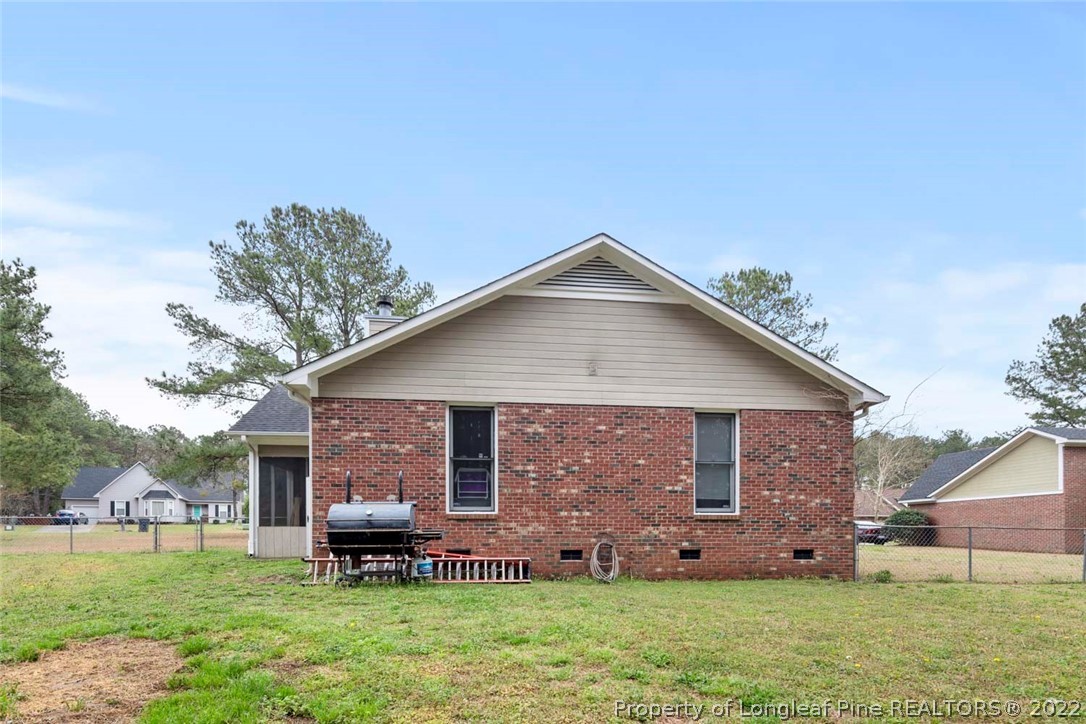 114 Windsor Lane Raeford, NC 28376 - Photo 32 of 32 a front view of a house with a garden and plants