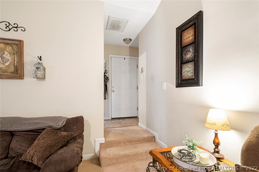 114 Windsor Lane Raeford, NC 28376 - Photo 5 of 32 a living room with furniture and a wooden floor