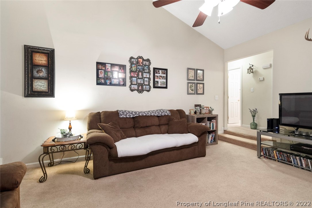 114 Windsor Lane Raeford, NC 28376 - Photo 7 of 32 a living room with furniture and a flat screen tv