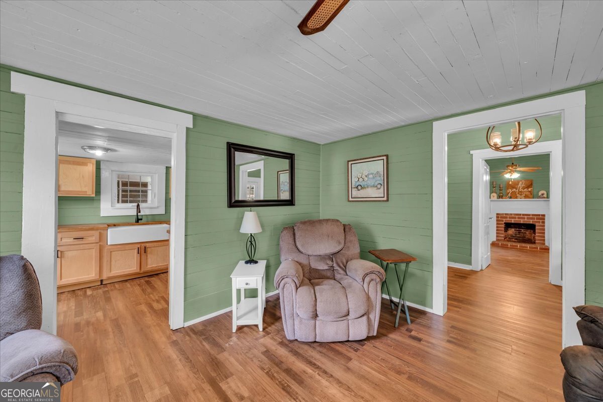 3613 S Highway Dublin, GA 31021 - Photo 11 of 52 a living room with furniture and wooden floor