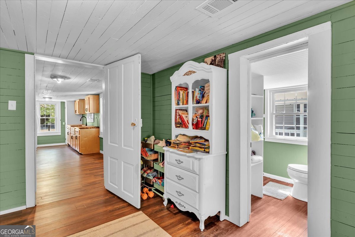 3613 S Highway Dublin, GA 31021 - Photo 22 of 52 a view of a hallway and wooden floor and dining room