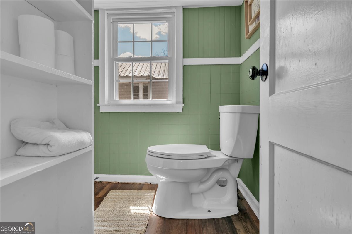 3613 S Highway Dublin, GA 31021 - Photo 23 of 52 a bathroom with a toilet and a sink