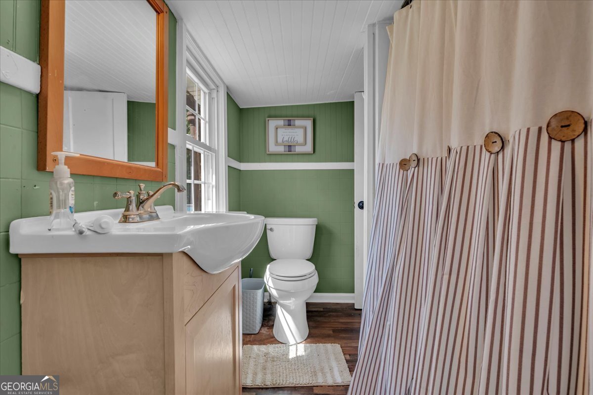 3613 S Highway Dublin, GA 31021 - Photo 24 of 52 a bathroom with a sink a toilet and shower