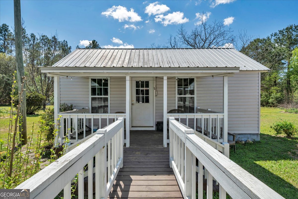 3613 S Highway Dublin, GA 31021 - Photo 27 of 52 a view of a house with backyard and deck