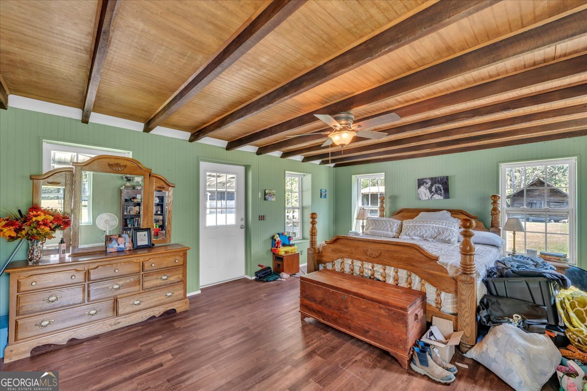 3613 S Highway Dublin, GA 31021 - Photo 33 of 52 a bedroom with furniture and wooden floor