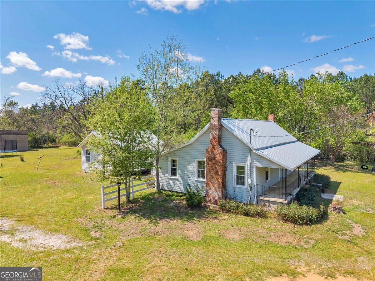 3613 S Highway Dublin, GA 31021 - Photo 36 of 52 a view of a house with a yard