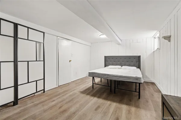 a room with wooden floor and pool table