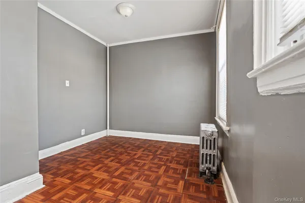 an empty room with wooden floor