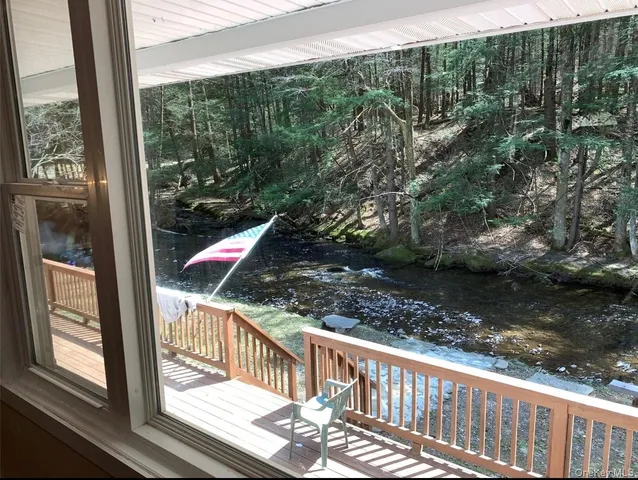 a bathroom with a sink a mirror and a shower