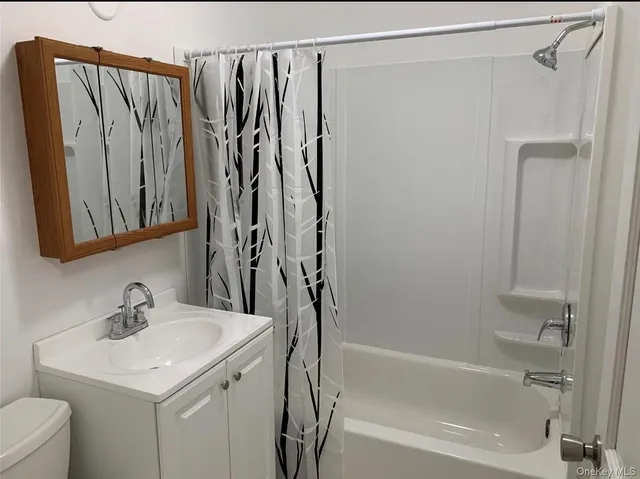 an empty room with wooden floor