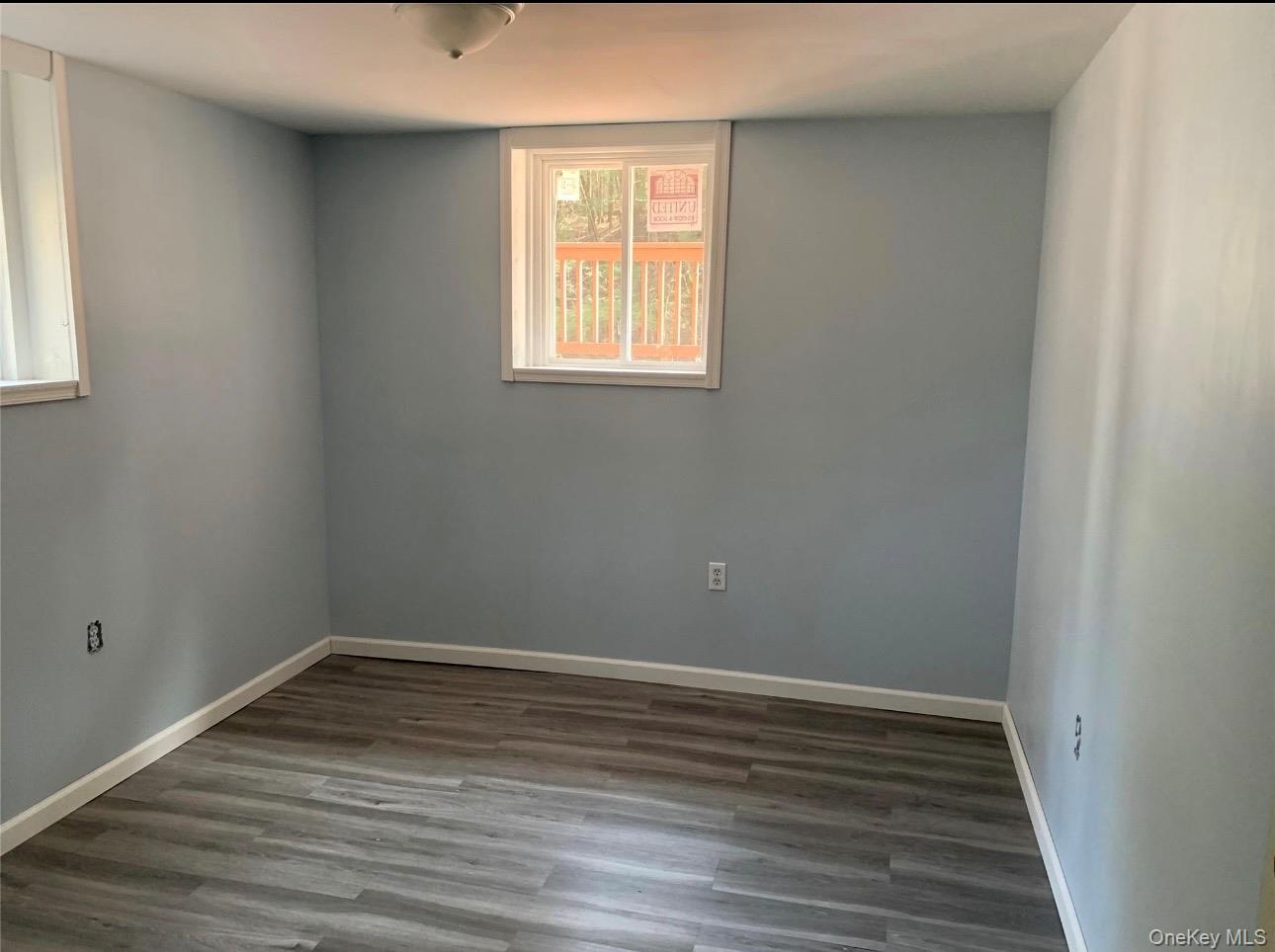 604 Basket Road Long Eddy, NY 12760 - Photo 32 of 37 a view of an empty room with wooden floor and a window