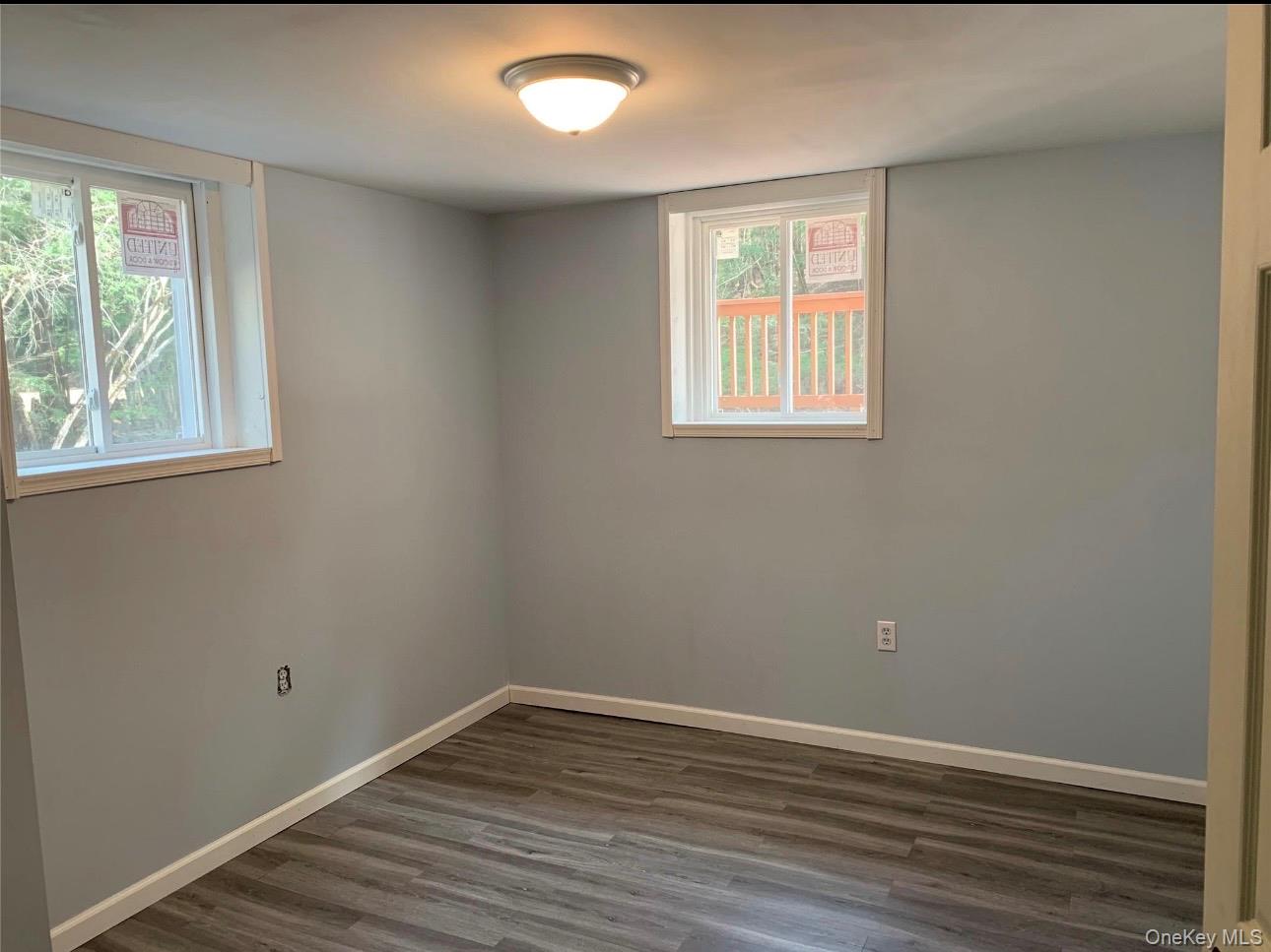 604 Basket Road Long Eddy, NY 12760 - Photo 33 of 37 an empty room with wooden floor and windows