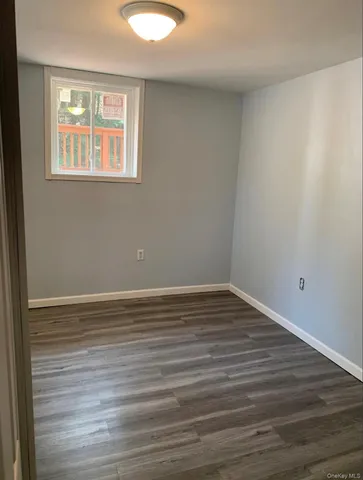 a bathroom with a shower and a sink