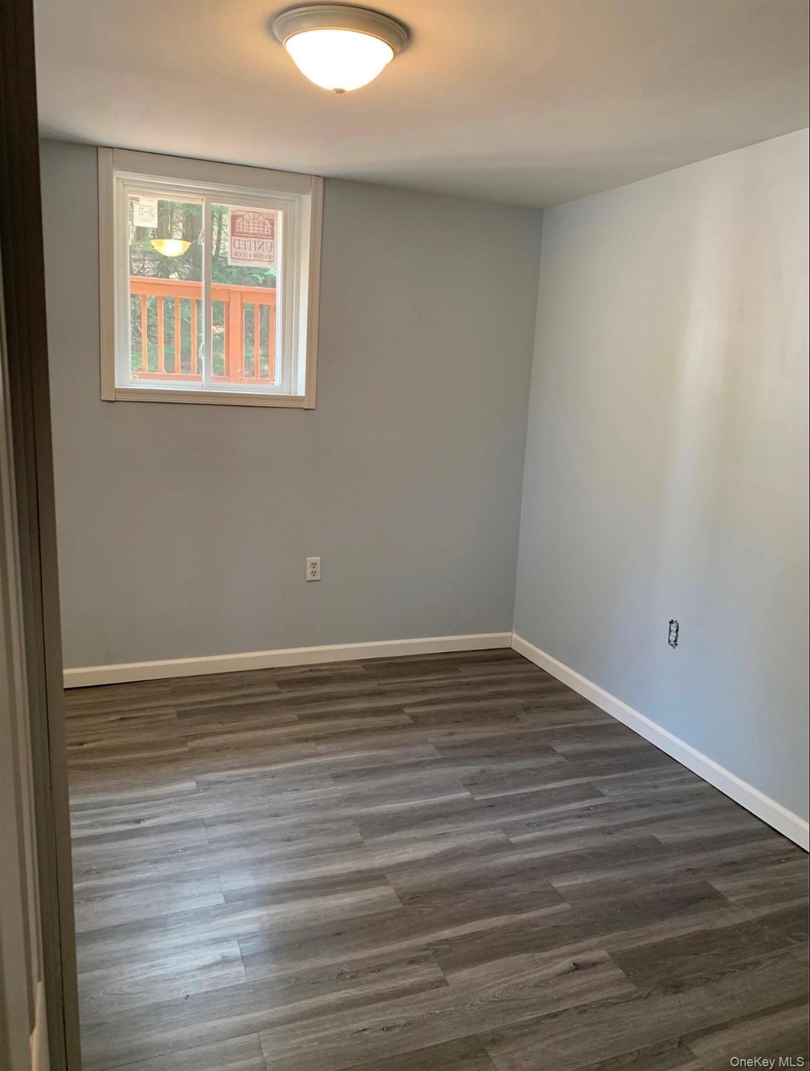 604 Basket Road Long Eddy, NY 12760 - Photo 35 of 37 a view of an empty room with wooden floor and a window