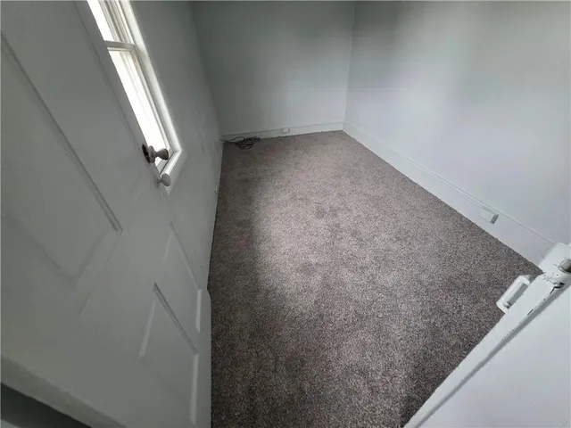 a kitchen with wooden cabinets and black appliances