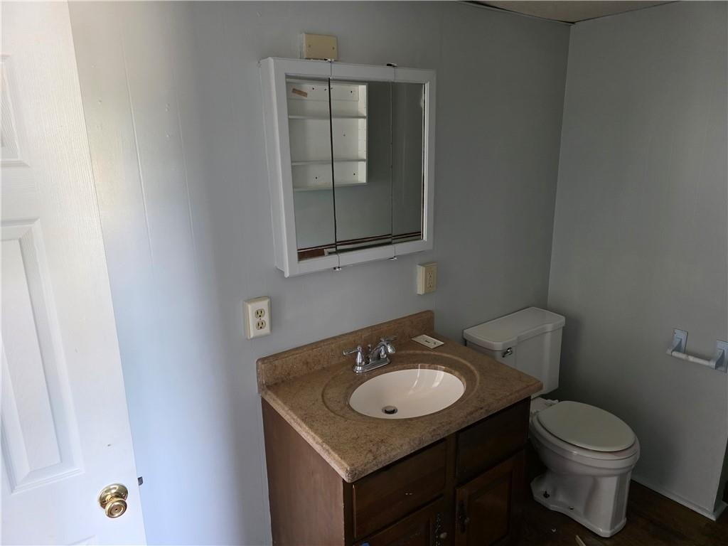 79 Ridge Avenue Homer City, PA 15748 - Photo 10 of 13 a bathroom with a sink toilet and mirror