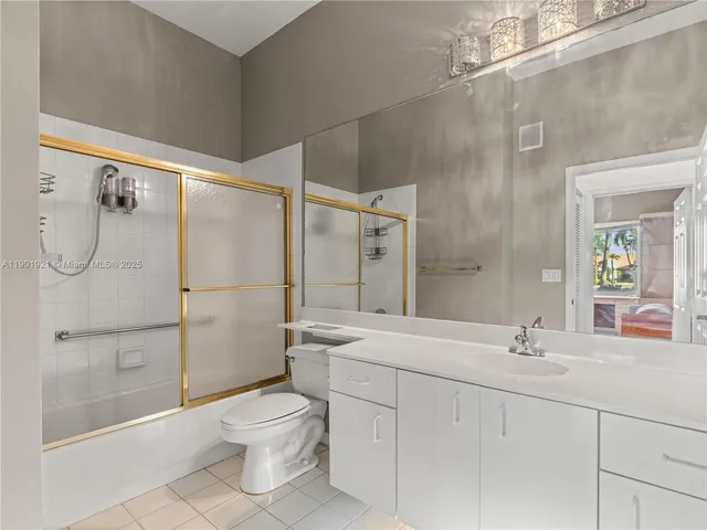 a kitchen with cabinets stainless steel appliances and a sink