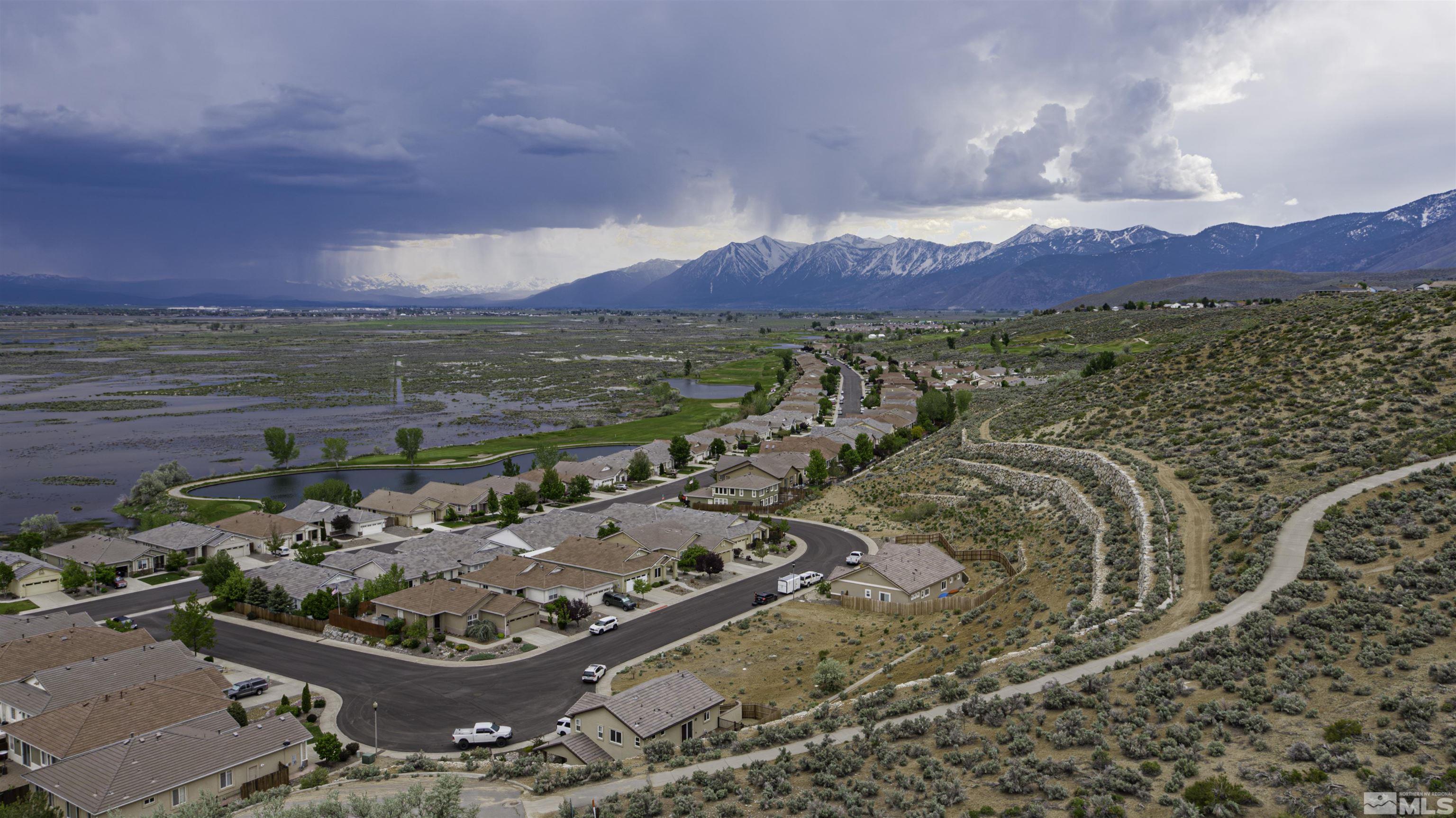 1086 Tee Drive Carson City, NV 89705 - Photo 12 of 12 a view of a lake with a mountain
