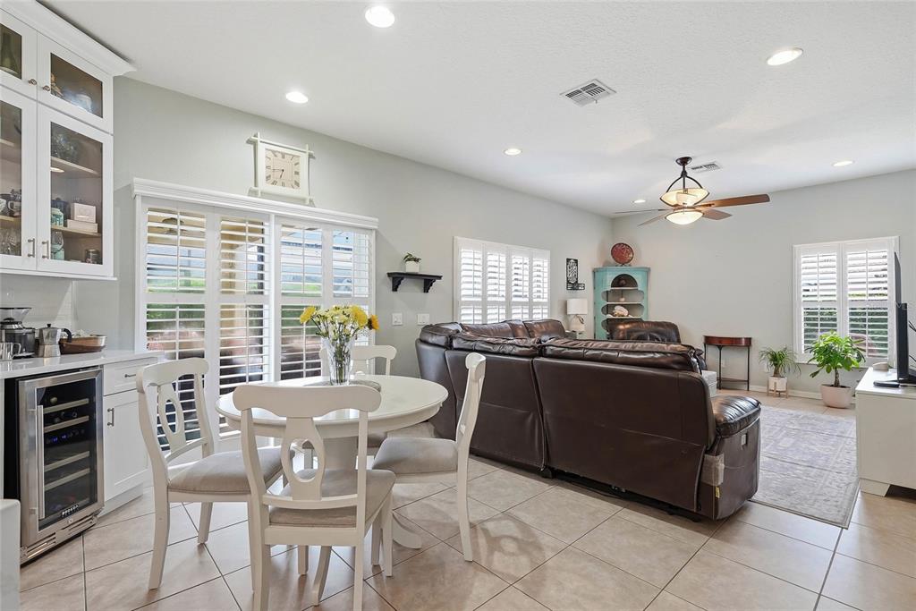 16748 Midsummer Lane Spring Hill, FL 34610 - Photo 18 of 52 a living room with furniture and a large window