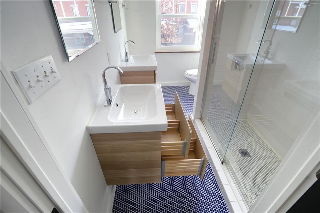 315 Main Street Pittsburgh, PA 15201 - Photo 14 of 23 a bathroom with a sink and a mirror