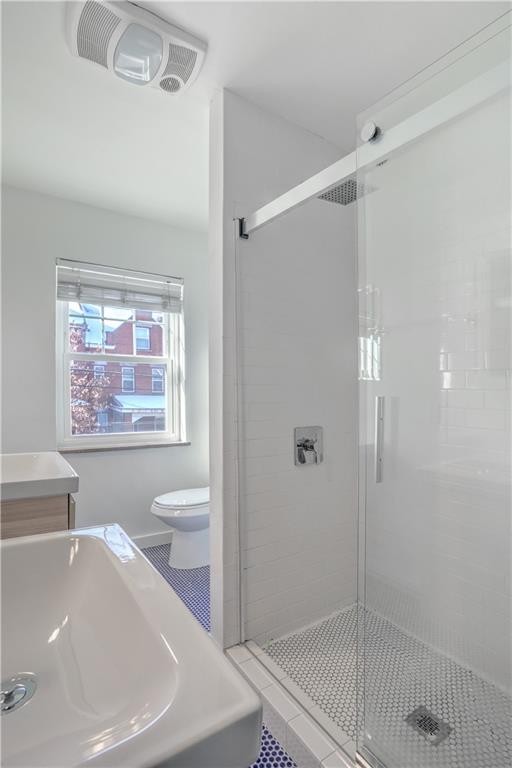315 Main Street Pittsburgh, PA 15201 - Photo 15 of 23 a bathroom with a sink a toilet and shower